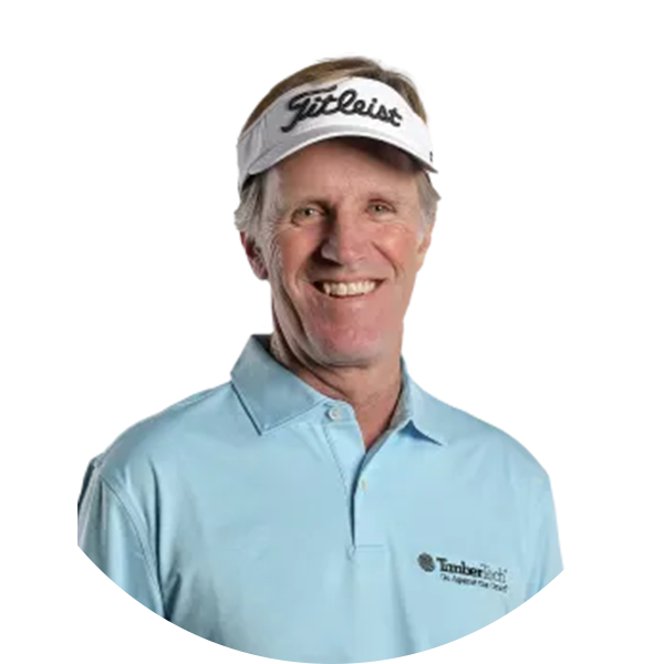 Man wearing a visor and polo shirt smiling, likely a golf coach.