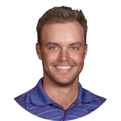Smiling golf player wearing a blue and red striped shirt.