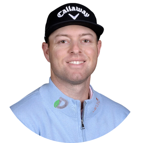 Golfer wearing a Callaway hat and light blue jacket smiling.