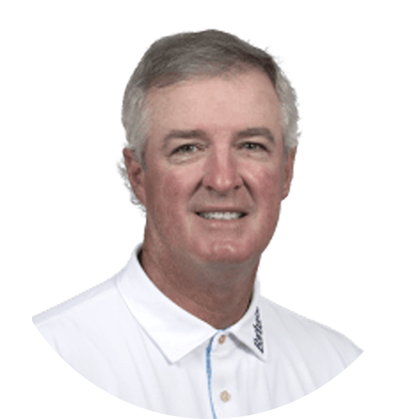 Smiling older man in a white polo shirt.