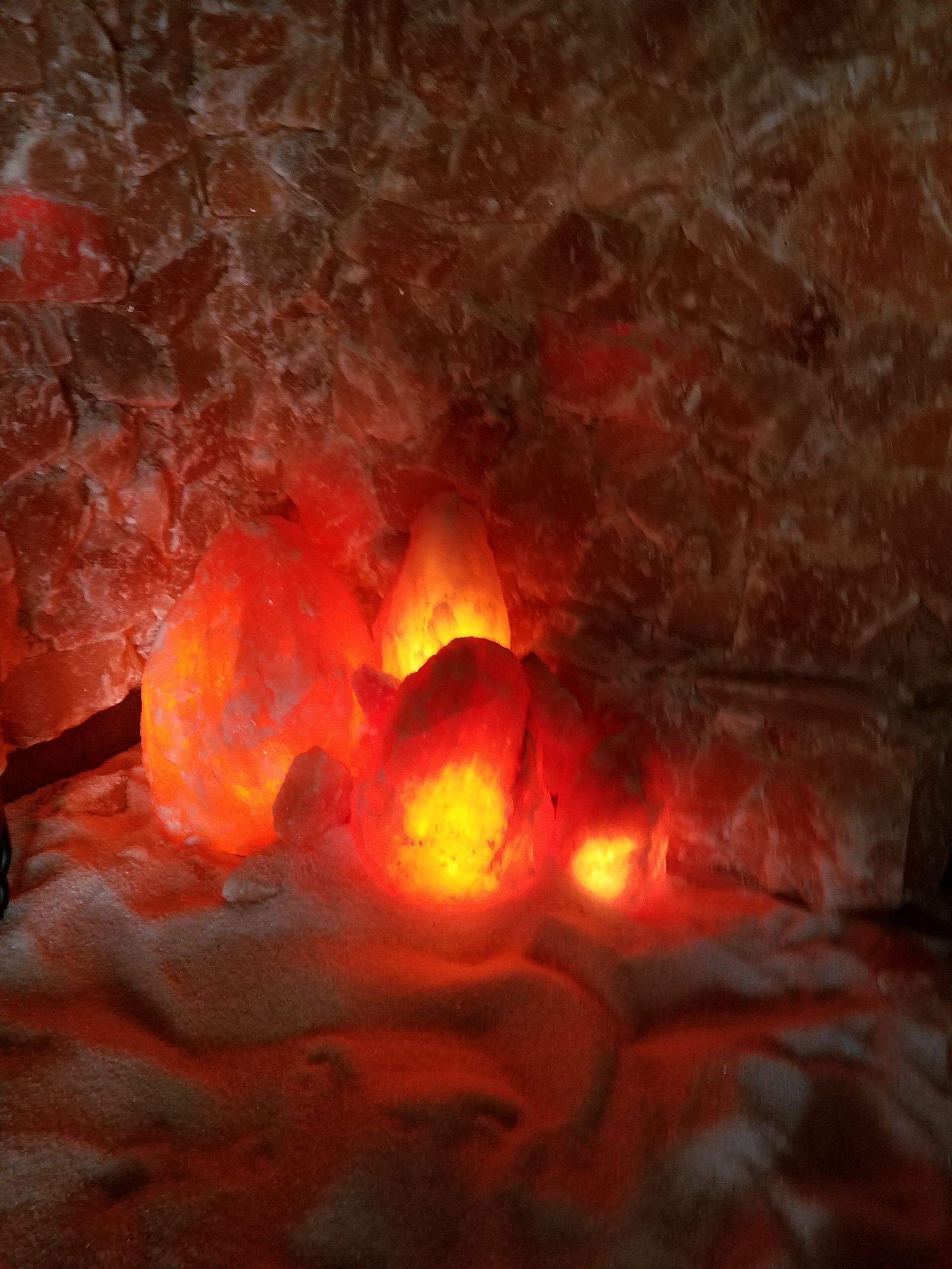 A close up of a rock with a red light coming out of it.