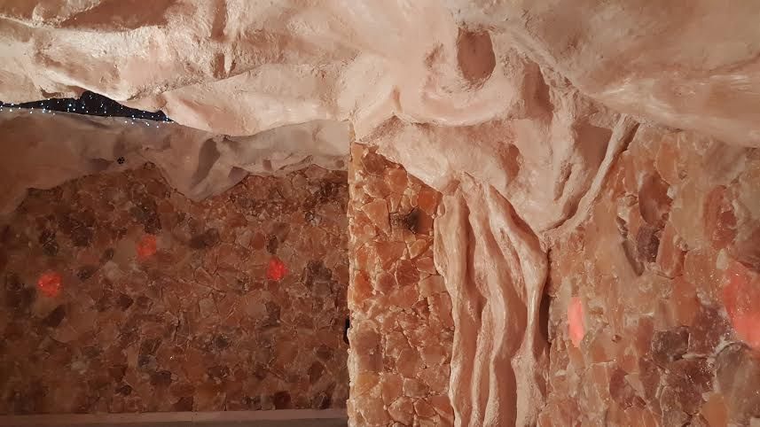 Stone wall with pink insulation; possible crawlspace.