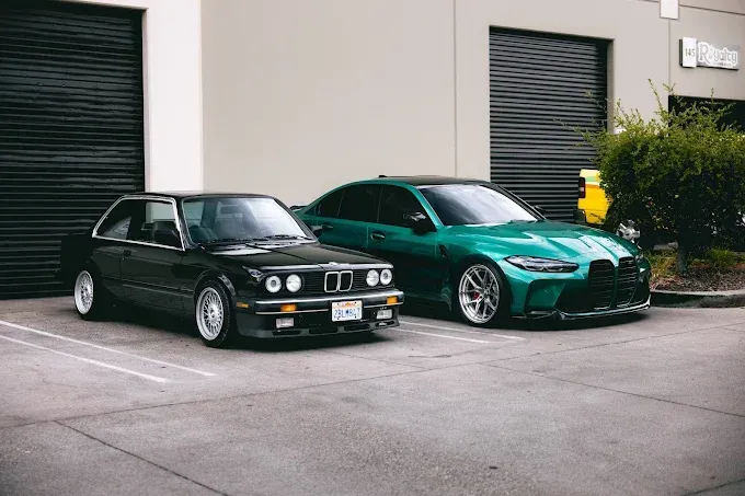 Black BMW E30 M3 and green G80 M3 after ceramic coating service at Wet Paint Auto Detailing