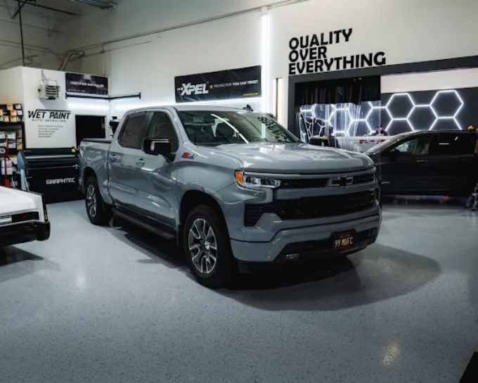 Gray Chevy Silverado getting paint protection film applied in Roseville