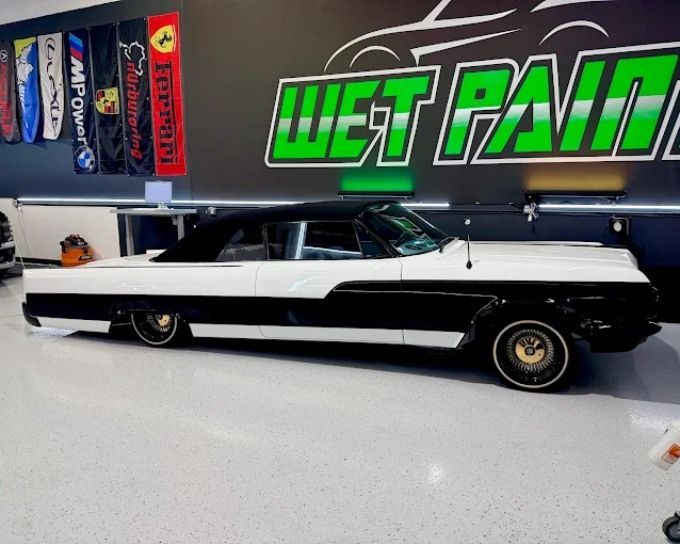 Classic black and white convertible after ceramic coating at Wet Paint Auto Detailing
