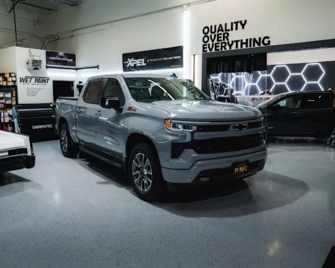 Silver Chevrolet Silverado truck with paint protection film (PPF) at Wet Paint Auto Detailing shop
