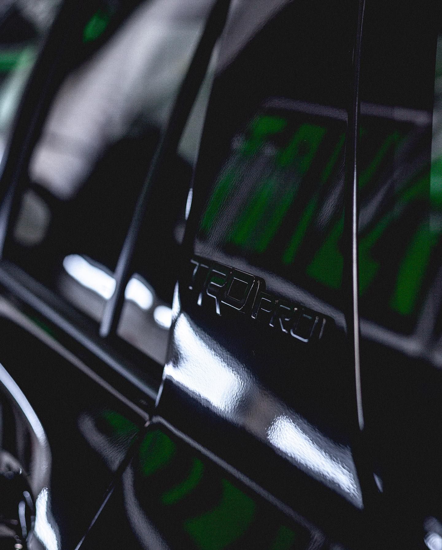 Black car door detail with