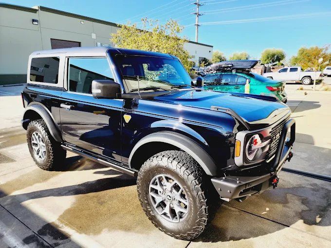 Lifted black Ford Bronco parked outside Wet Paint shop after receiving a ceramic coating treatment