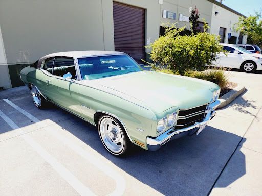 Vintage green Chevrolet Monte Carlo with ceramic coating finish parked outdoors