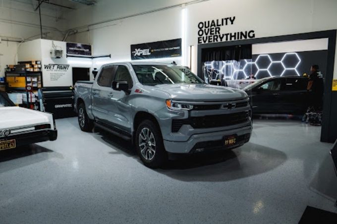 Silver Chevy Silverado truck in Wet Paint's Quality Over Everything bay ready for PPF installation