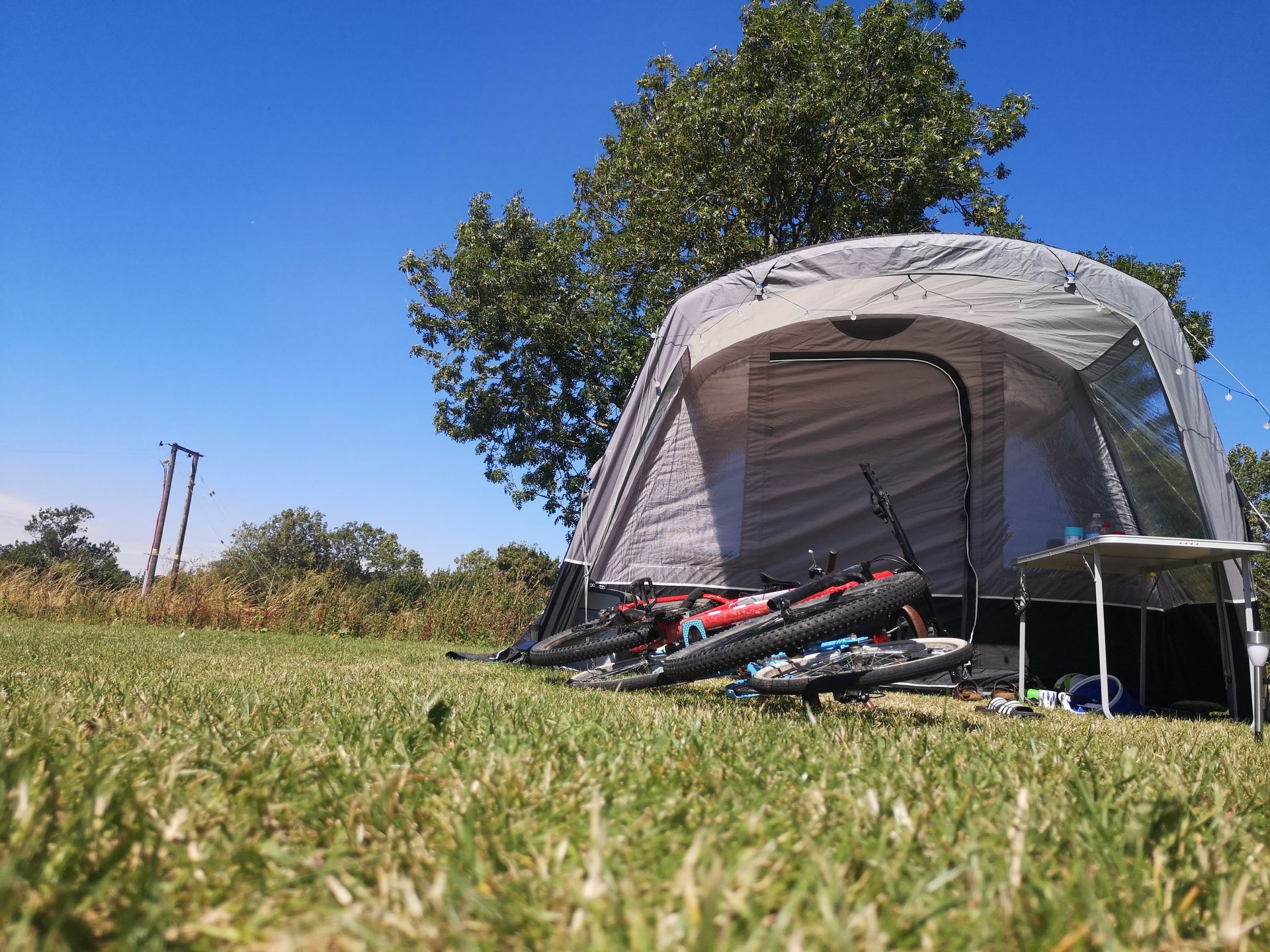 Grass Pitch with tent and bicycles