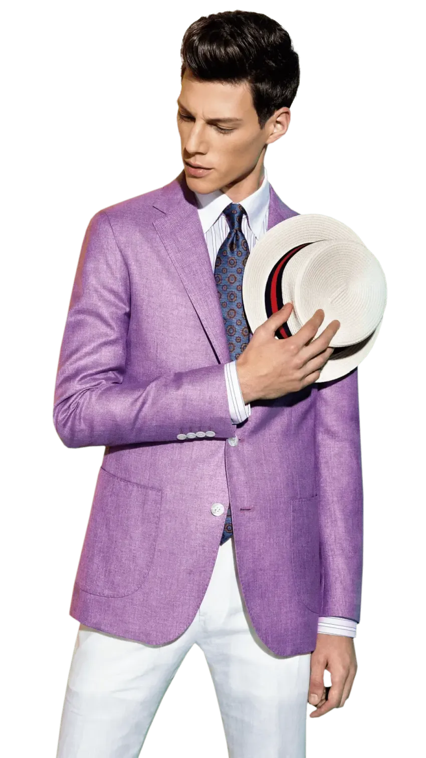 Man in a lavender blazer and white pants holding a beige hat against a white background