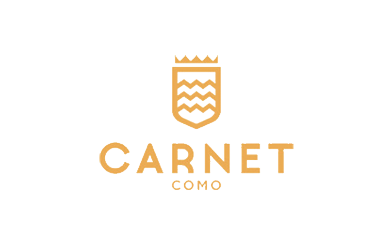 Gold Carnet Como logo with a crowned shield icon above the text