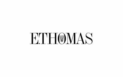 Black-and-white “ETHOMAS” logo with a stylized “H” in the center