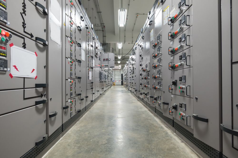 Electrical Control Room With Rows of Gray Panels — Lit Energy in Marian, QLD