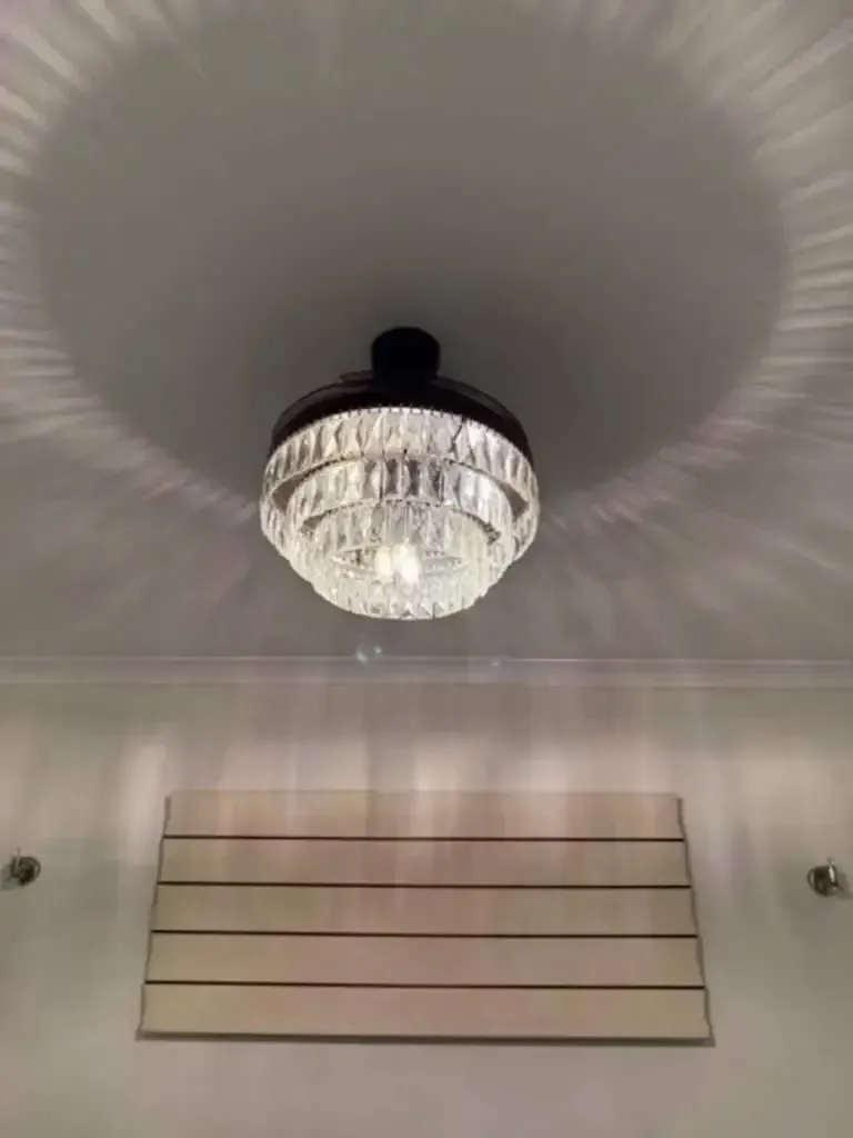 Chandelier With a Round, Tiered Crystal Design Casting a Halo Shadow — Lit Energy in Rural View, QLD