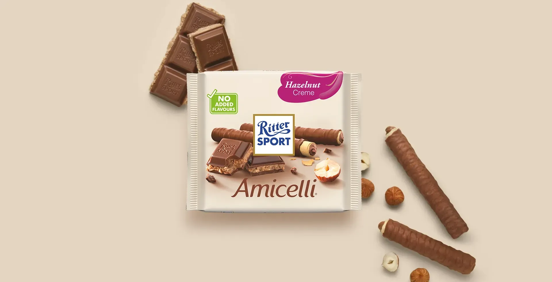 Ritter Sport chocolate bar packaging with cocoa beans, broken chocolate, and milk on a blue background.