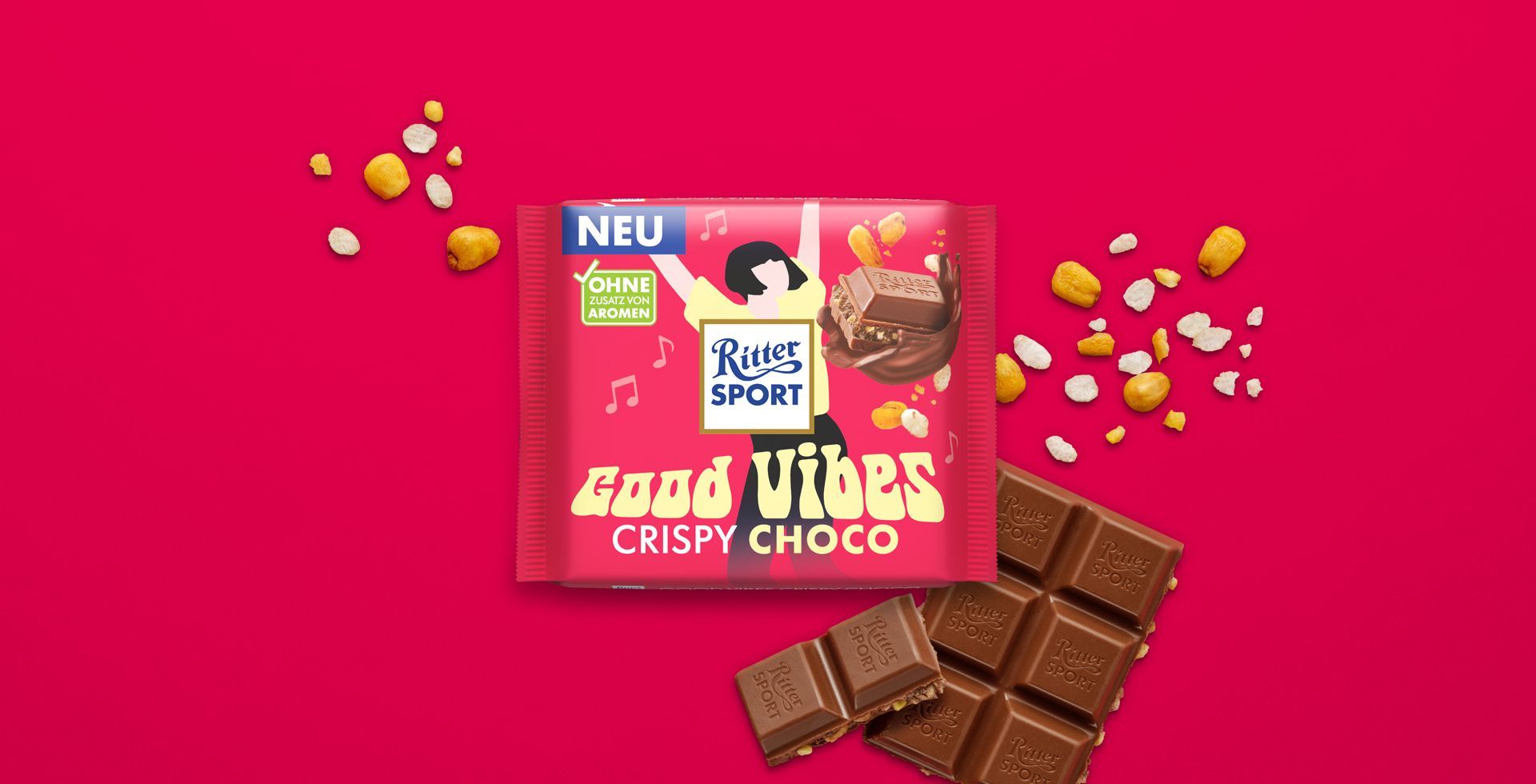 Verpackung einer blauen Schokoladentafel mit Nüssen, Schokoladenstückchen und dem Hinweis „55 % Kakaoanteil“ auf blauem Hintergrund