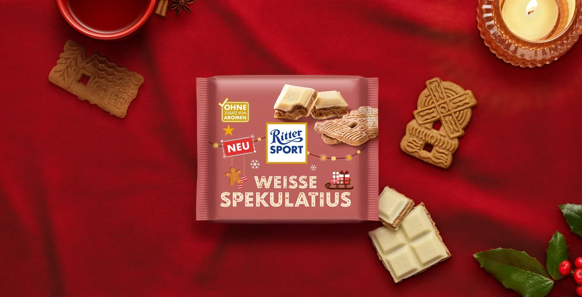 Verpackung einer blauen Schokoladentafel mit Nüssen, Schokoladenstückchen und dem Hinweis „55 % Kakaoanteil“ auf blauem Hintergrund