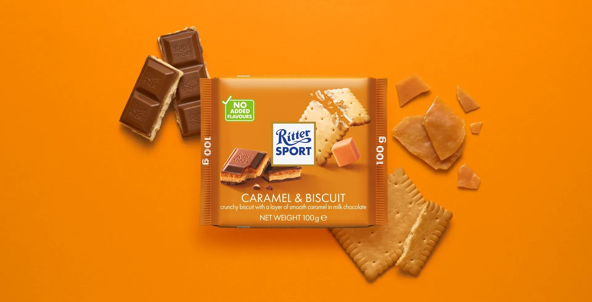 Ritter Sport chocolate bar packaging with cocoa beans, broken chocolate, and milk on a blue background.