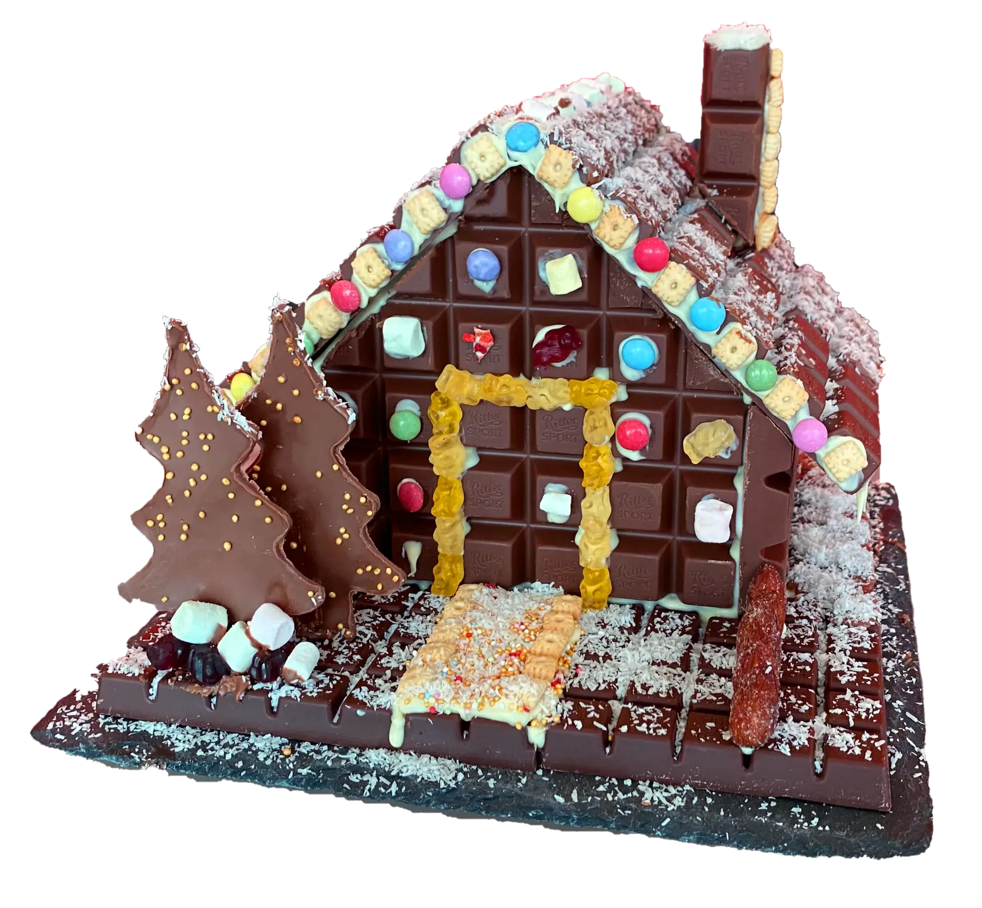 Chocolate gingerbread house decorated with colorful candies and marshmallows.