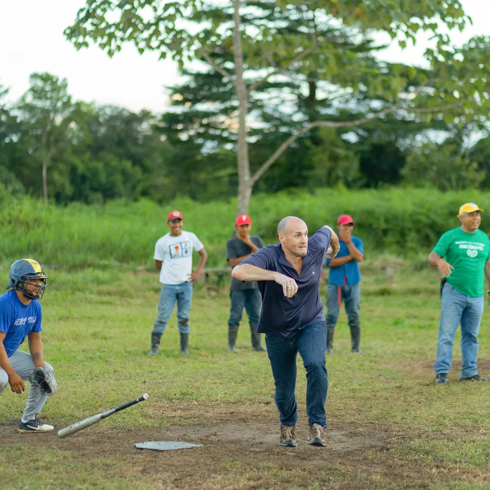A group of men are playing baseball in a field.