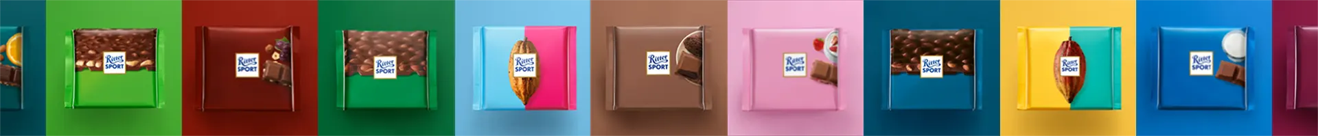 A row of colorful chocolates are lined up in a row.