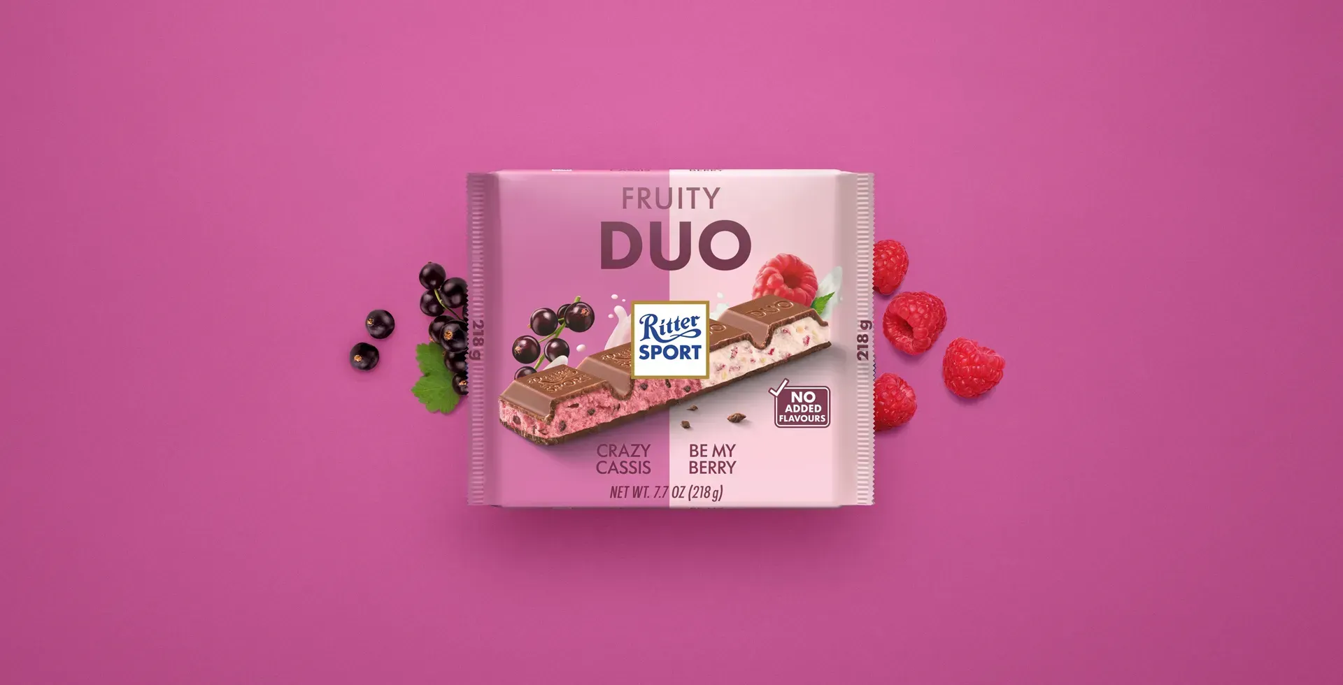 Ritter Sport chocolate bar packaging with cocoa beans, broken chocolate, and milk on a blue background.
