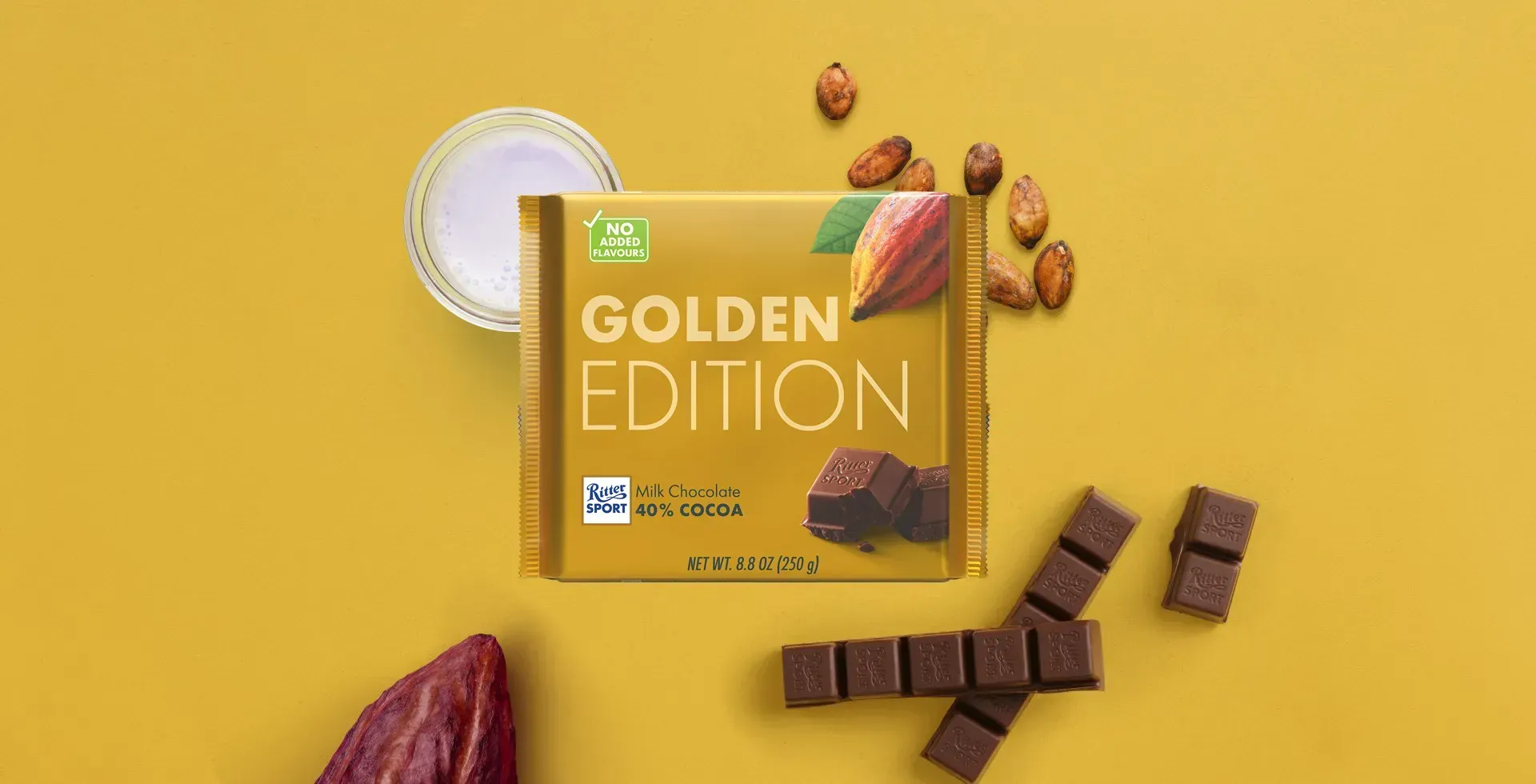 Ritter Sport chocolate bar packaging with cocoa beans, broken chocolate, and milk on a blue background.