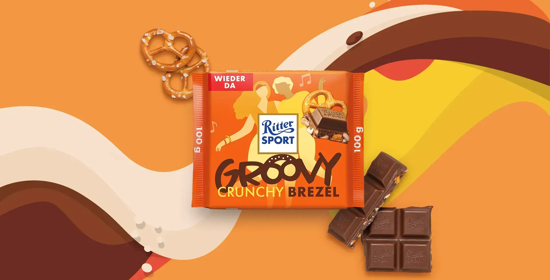 Verpackung einer blauen Schokoladentafel mit Nüssen, Schokoladenstückchen und dem Hinweis „55 % Kakaoanteil“ auf blauem Hintergrund