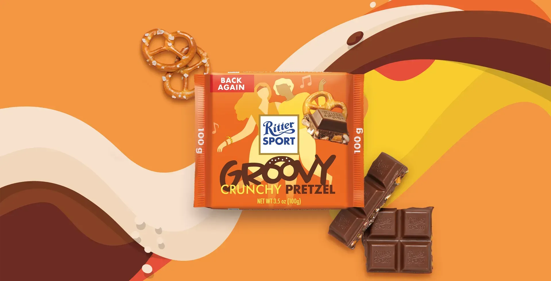 Ritter Sport chocolate bar packaging with cocoa beans, broken chocolate, and milk on a blue background.