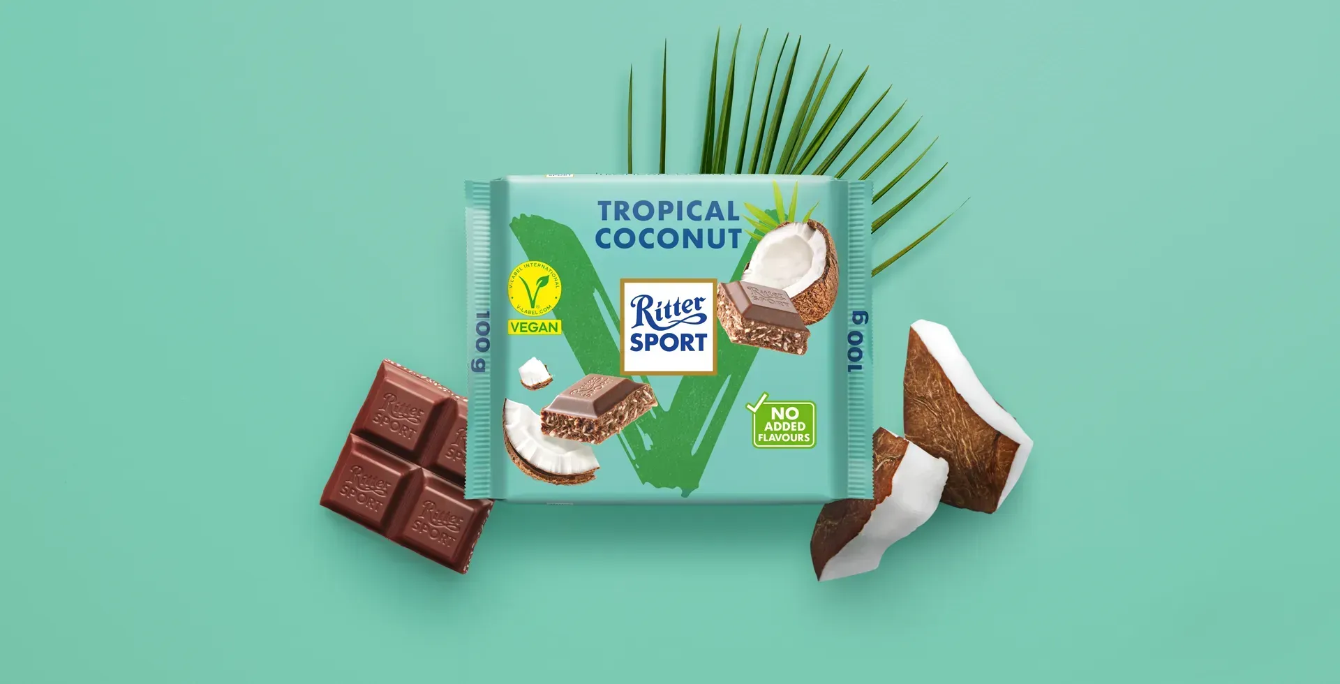 Ritter Sport chocolate bar packaging with cocoa beans, broken chocolate, and milk on a blue background.