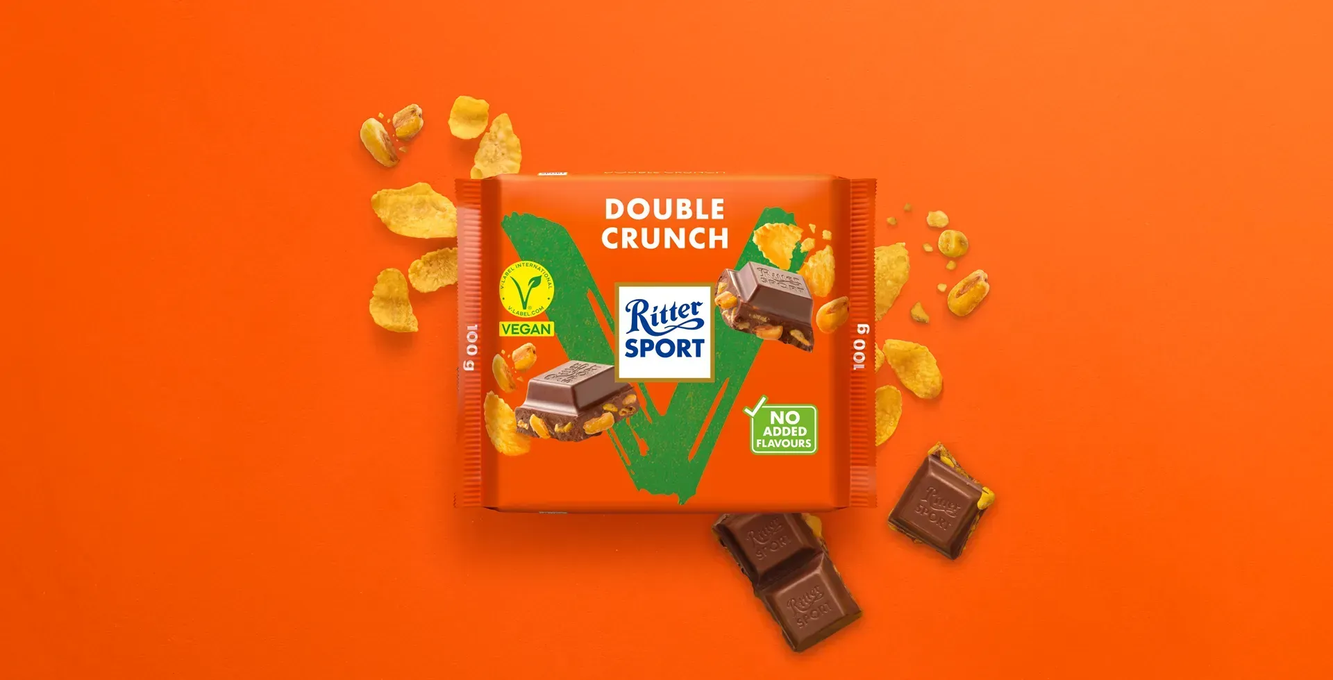 Ritter Sport chocolate bar packaging with cocoa beans, broken chocolate, and milk on a blue background.