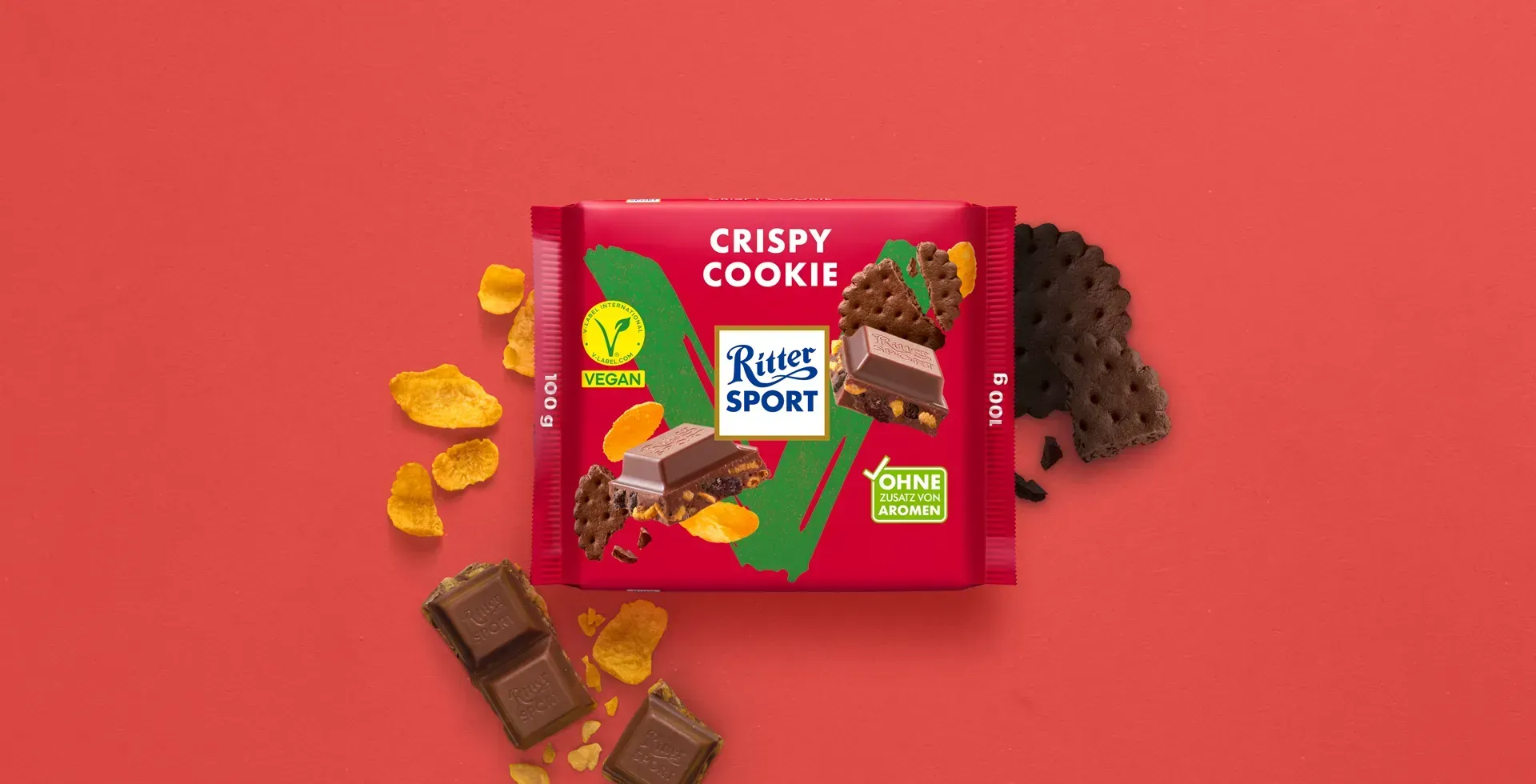Ritter Sport chocolate bar packaging with cocoa beans, broken chocolate, and milk on a blue background.
