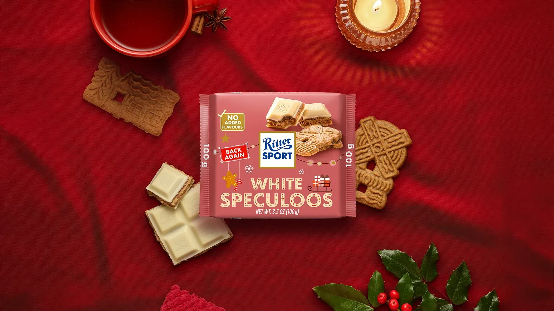 Ritter Sport chocolate bar packaging with cocoa beans, broken chocolate, and milk on a blue background.