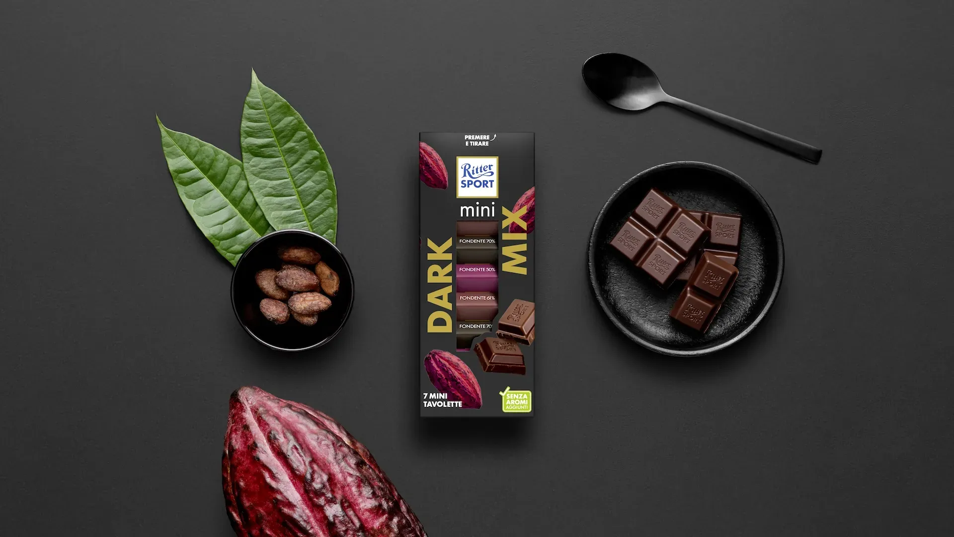 Ritter Sport chocolate bar packaging with cocoa beans, broken chocolate, and milk on a blue background.