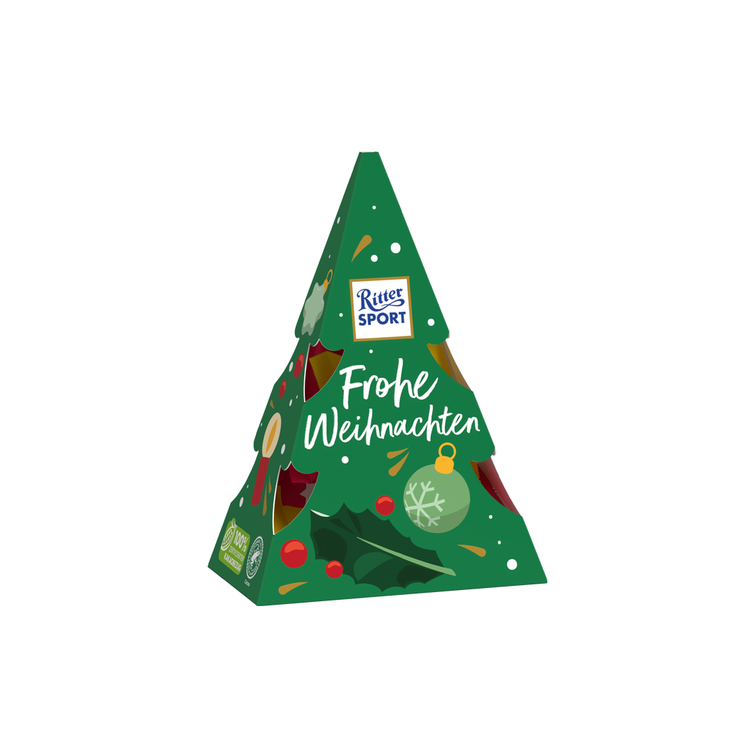 Grüne Ritter Sport Pralinenschachtel in Weihnachtsbaumform mit dem Text „Frohe Weihnachten“ und festlichen Dekorationen.