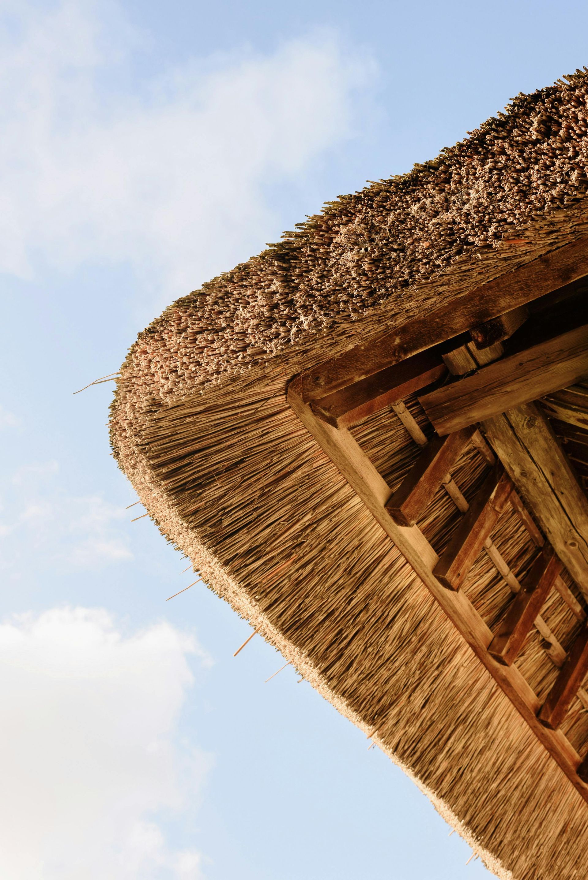 A thatched roof with a blue sky in the background In Layton Utah
