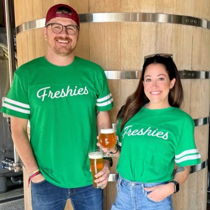 Two people in green