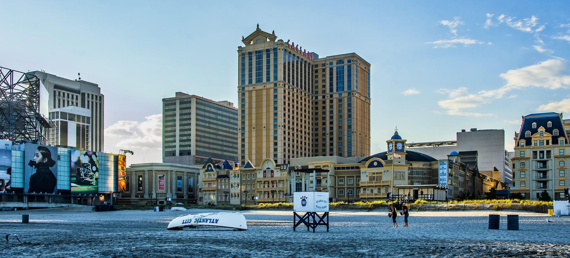 A city with a lot of buildings and a beach in the foreground.