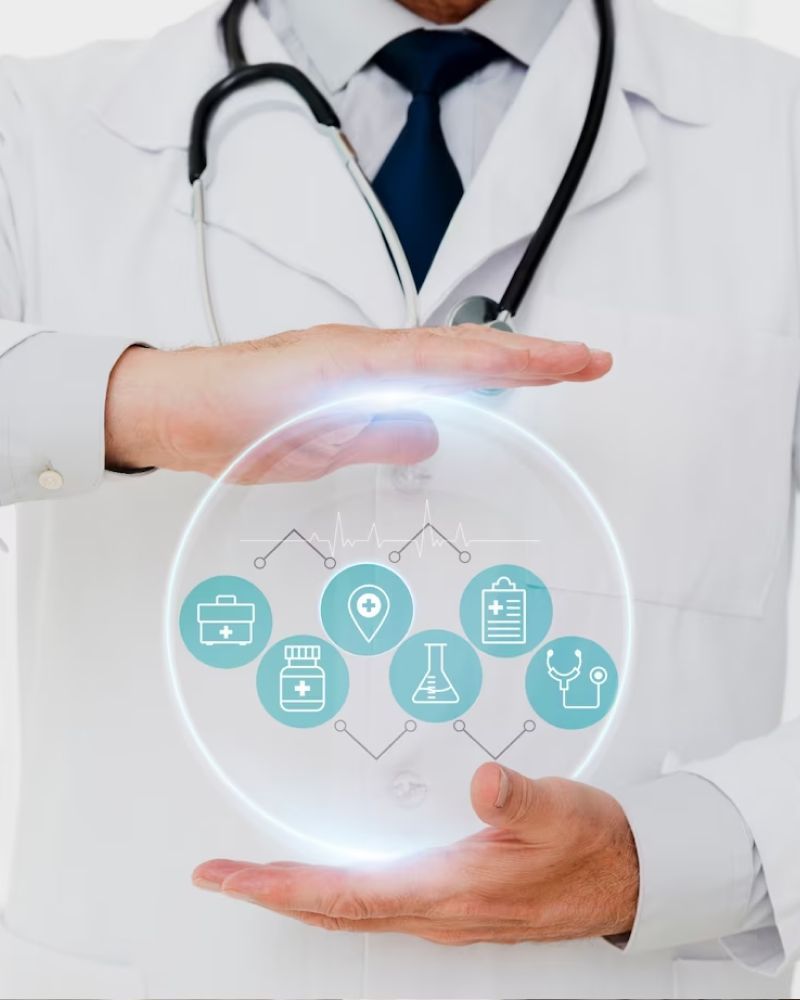 A doctor is holding a sphere with medical icons on it