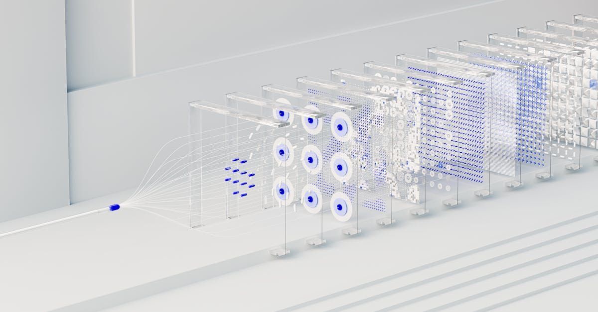 A row of clear blocks with blue dots on them are lined up on a white surface.
