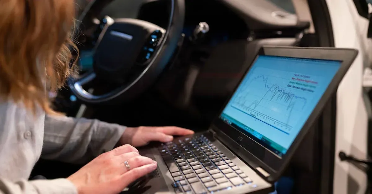 A woman is typing on a laptop in a car.