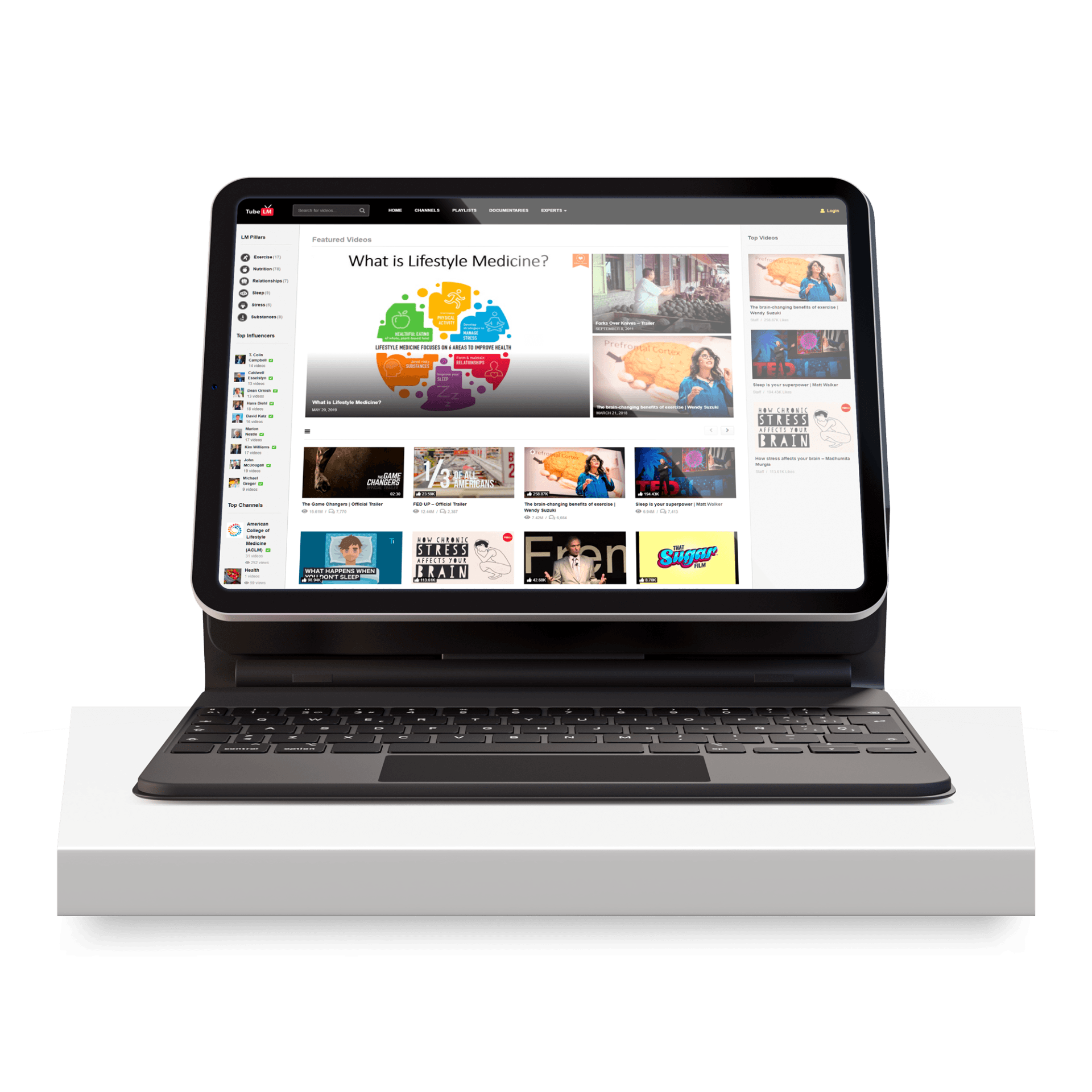 A laptop computer is sitting on top of a white box.