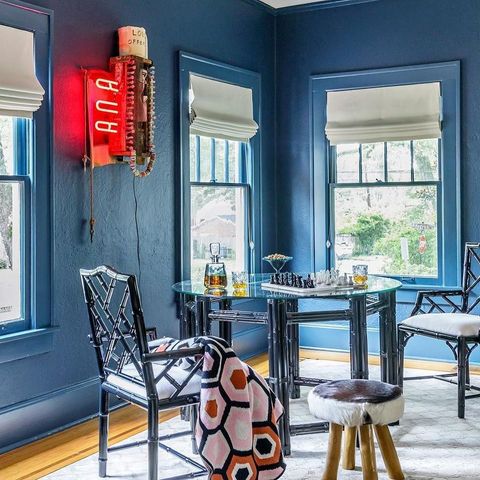 Blue interior painted sitting room with minimalist furnishings