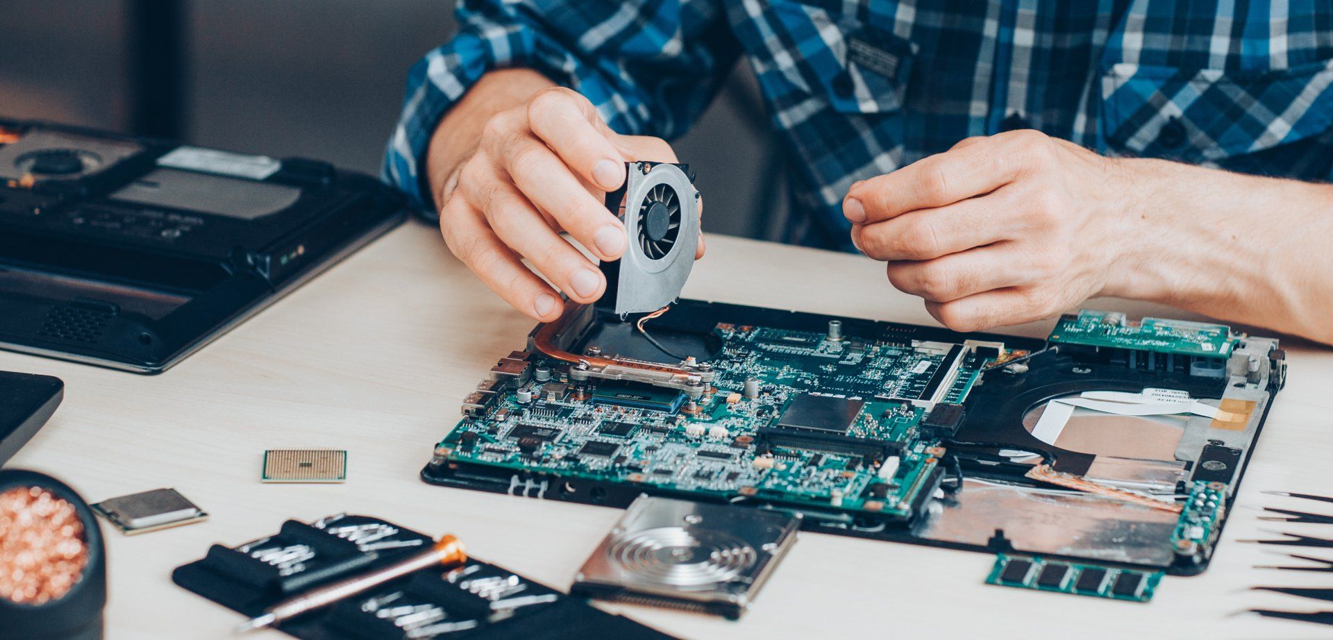 Man Repairing a Laptop — Woodvale, WA — Ashton Technology