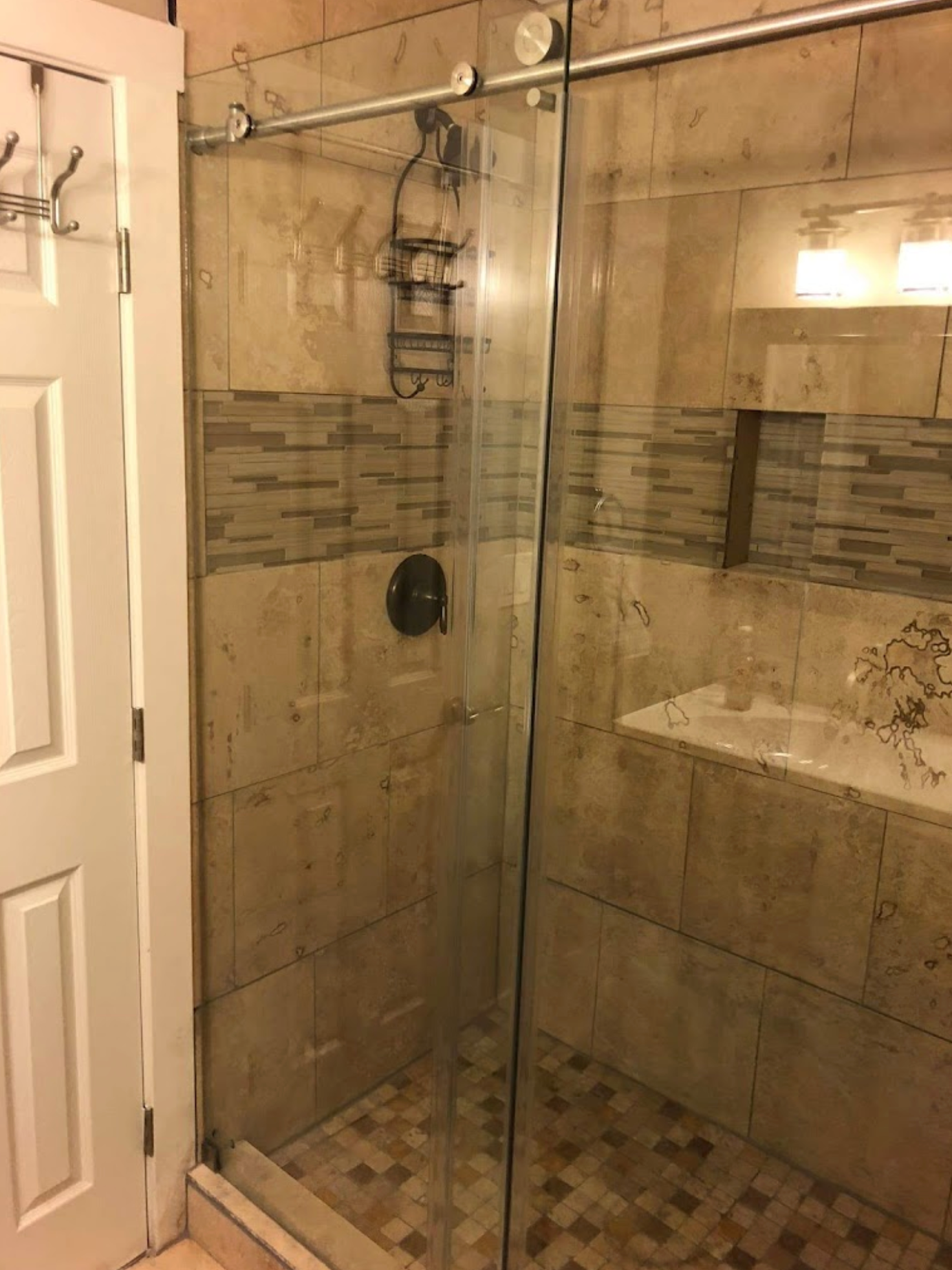 A bathroom with a walk in shower and a bathtub
