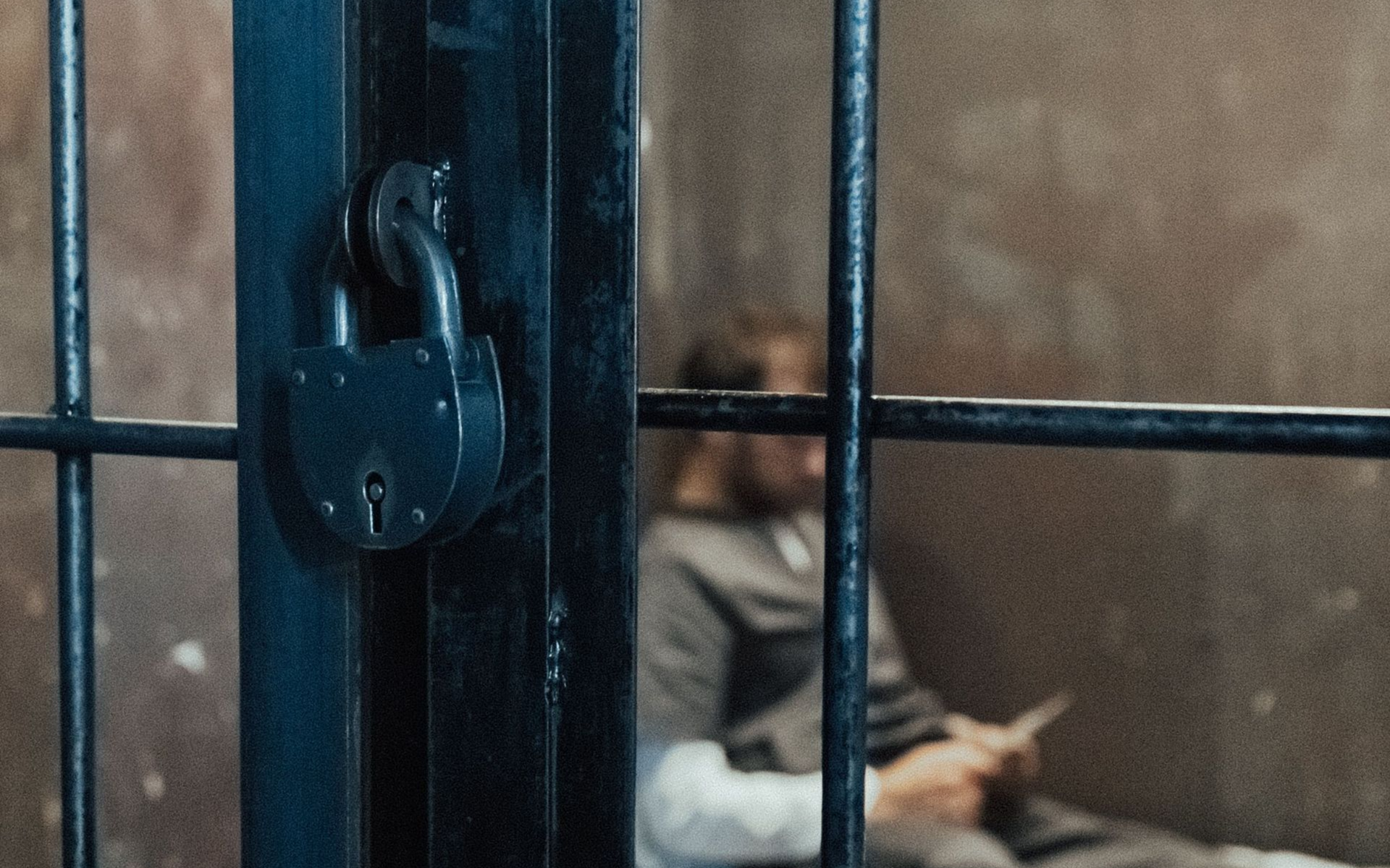 Inmate reviewing documents inside a detention facility