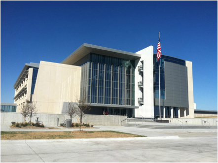 A large building with a flag that says ' texas ' on it