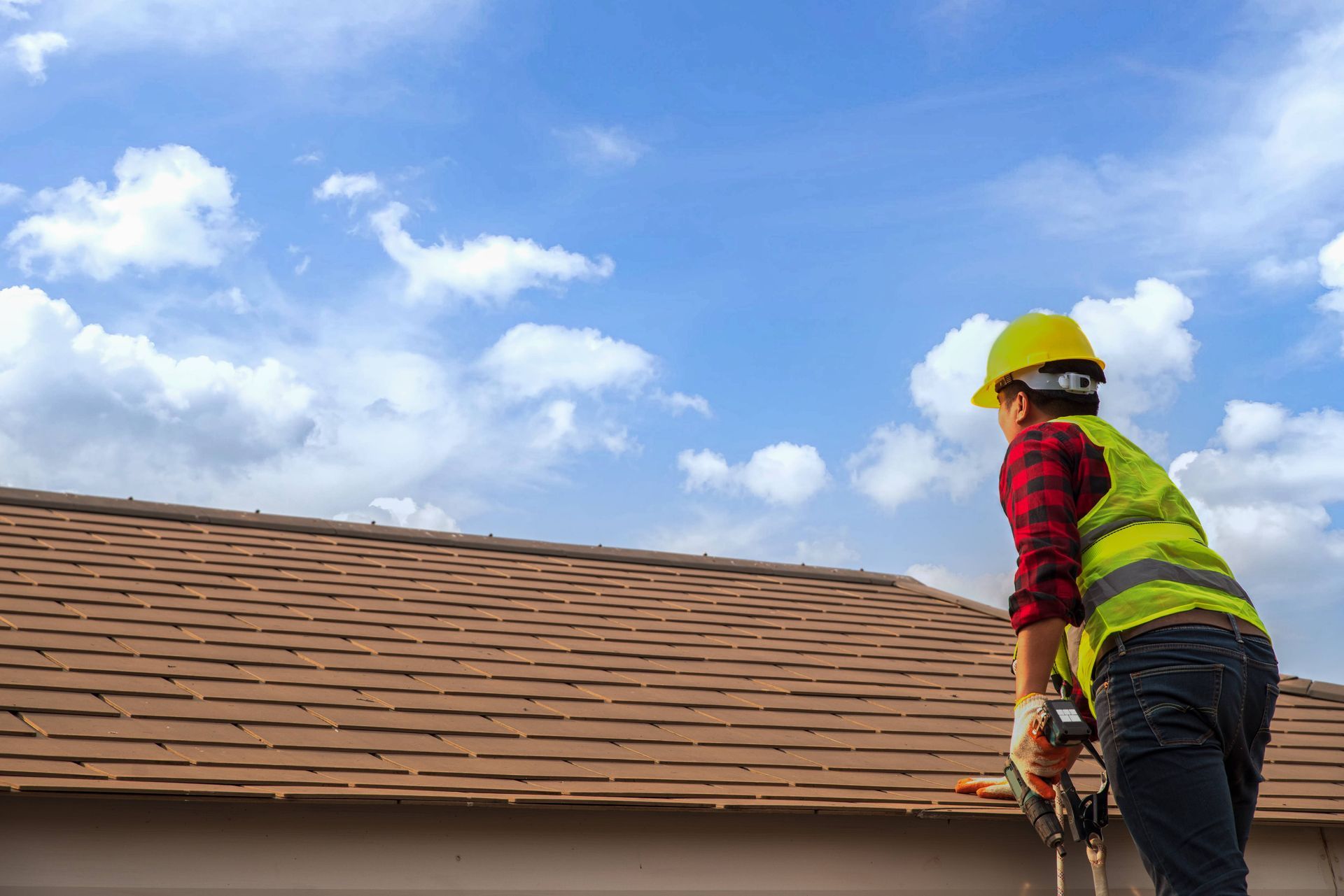 Roofing professional inspecting a roof to give a roof estimate near Lincoln, NE